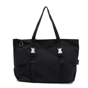 Black canvas tote bag for women, large capacity casual travel shoulder bag with metal buckles.