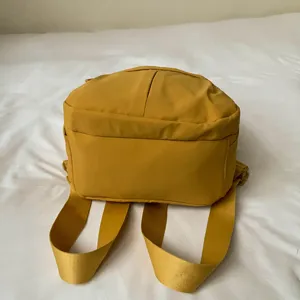 Lightweight nylon mini backpack for women, minimalist casual daypack for daily commute.