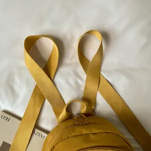 Mini nylon backpack detail view, casual yellow school bag for women daily commute lightweight design