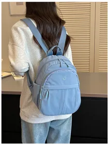 Lightweight nylon mini backpack detail, casual minimalist design for daily commute.