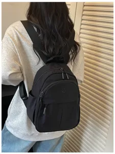 Casual nylon mini backpack for women, lightweight minimalist design, versatile daily school bag.