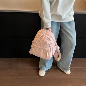 Lightweight nylon small backpack for women, casual minimalist versatile school bag daily commute.