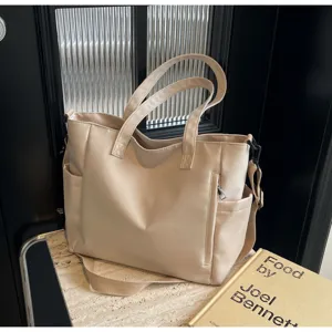 Detail view of the waterproof nylon tote bag showcasing spacious design and neat stitching details.