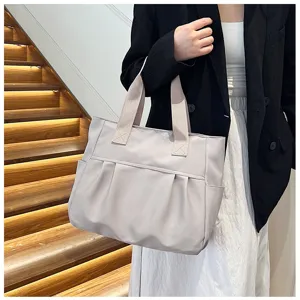 Large capacity nylon tote bag for women, simple casual shoulder handbag for daily commuting.
