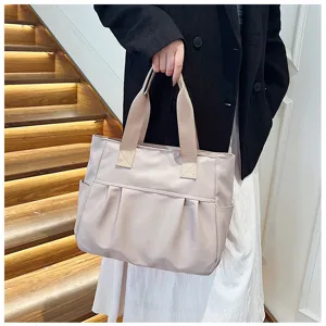 Large capacity nylon tote bag detail view, casual shoulder bag for women daily commuting style.