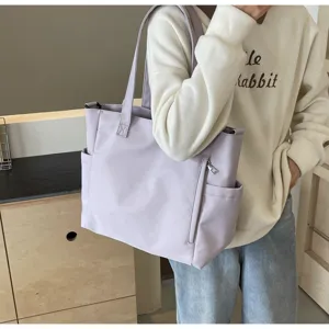 Light purple waterproof nylon tote bag, large capacity casual shoulder bag for women daily use.