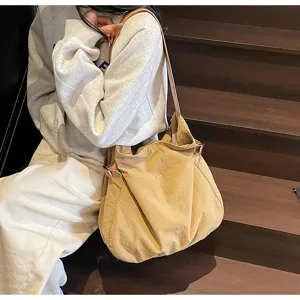 Lightweight nylon shoulder bag detail, simple commuter tote handbag for daily women use.
