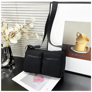 Detailed view of black nylon crossbody shoulder bag with dual front zipper pockets for daily use.