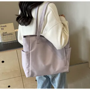 Waterproof nylon tote bag for women, large capacity minimalist solid color shoulder bag.