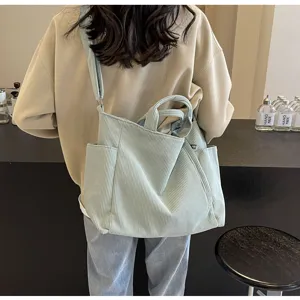 Detail view of casual sage green corduroy tote bag, large capacity shoulder and crossbody bag.