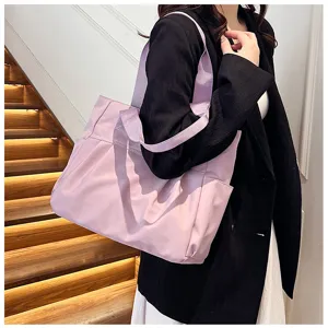 Detail shot of a stylish large-capacity purple nylon tote bag, perfect for daily use.