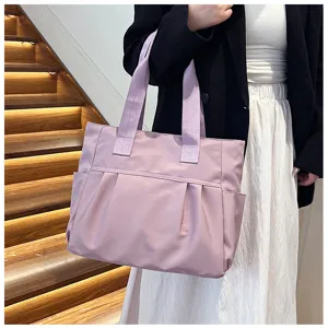 Close-up view of a large capacity nylon tote bag in light purple, showcasing commuter style.