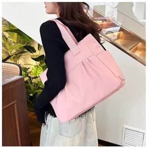 Large capacity nylon tote bag for women, minimalist shoulder bag and casual commuter handbag.