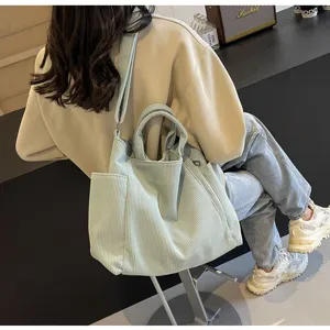 Trendy large capacity corduroy tote bag for women, casual shoulder crossbody bag for daily commute.