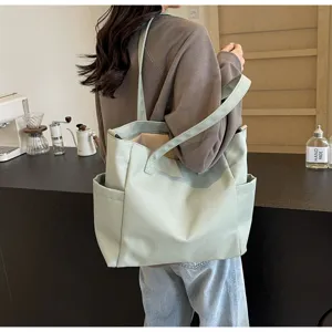 Casual waterproof nylon tote bag detail view, solid color large capacity shoulder bag for daily use.