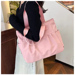 Large capacity nylon pink tote bag for women, stylish shoulder handbag for daily work or school.