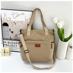 Versatile corduroy tote bag with large capacity, shoulder strap, and front pocket detail.