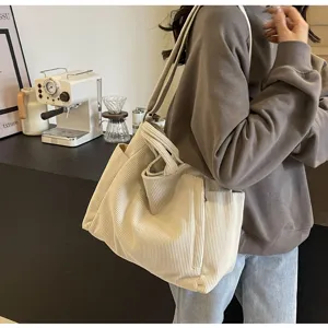 Large capacity beige corduroy tote bag detail, casual shoulder handbag for women daily commute.