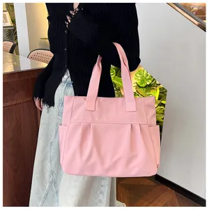 Large capacity nylon tote bag for women, stylish pink casual shoulder bag for daily commute.