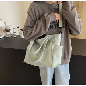 Waterproof nylon tote bag with large capacity, casual shoulder and crossbody design.