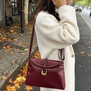 Women's burgundy leather shoulder bag minimalist envelope crossbody bag with braided knot.