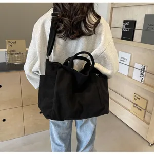 Black corduroy tote bag for women, large capacity shoulder bag and casual crossbody handbag.