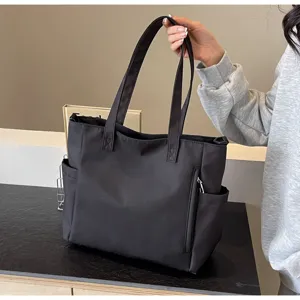 Waterproof nylon tote bag for women, large capacity casual shoulder bag with multiple pockets.