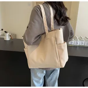 Minimalist waterproof nylon tote bag with large capacity, casual shoulder bag for women.