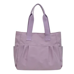 Large capacity purple nylon tote bag for women, stylish shoulder handbag for daily commute.