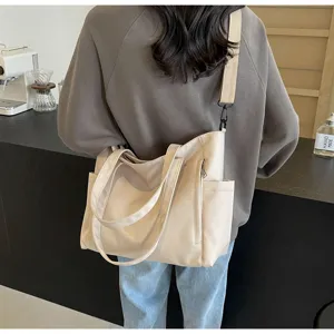 Waterproof nylon tote bag, large capacity solid color shoulder bag for daily casual use.