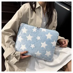 Plush laptop sleeve featuring blue and white star pattern, stylish and soft storage bag.