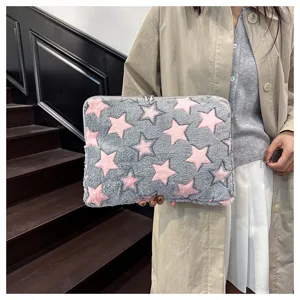 Fuzzy laptop sleeve with cute pink stars pattern, soft plush tablet storage bag for daily use.