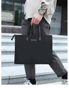 Detailed view of minimalist black business briefcase for men, large capacity waterproof bag.