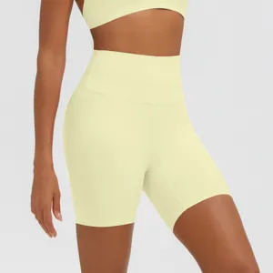 Shorts da yoga gialli a vita alta da donna, abbigliamento sportivo fitness traspirante.