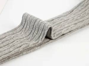 Detailed close-up view showing the soft grey cable knit over-the-knee socks texture.