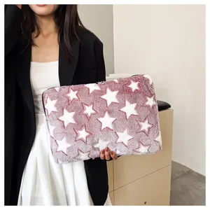 Fluffy plush laptop sleeve with cute star pattern, soft fleece tablet storage bag.
