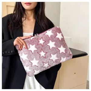 Plush laptop sleeve featuring cozy fuzzy texture and stylish star pattern for daily use.