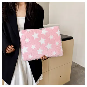 Close-up of pink star plush laptop sleeve, soft fluffy texture, cozy aesthetic tablet bag.
