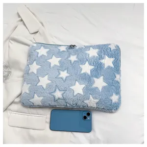 Blue plush laptop sleeve with white star pattern, soft padded tablet storage bag.