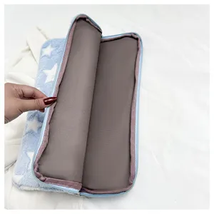 Plush tablet sleeve detail showing soft blue star fabric and smooth inner lining for protection.