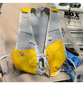 Outdoor running vest backpack detail shot, breathable mesh fabric, yellow and grey color.