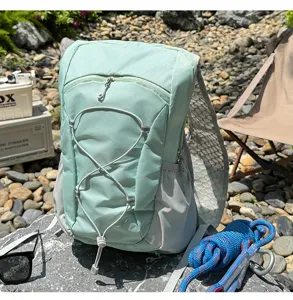 Mint green outdoor sports backpack with breathable mesh straps and front elastic bungee cord.