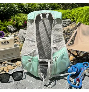 Detail view of mint green trail running vest with breathable mesh pockets and adjustable straps.