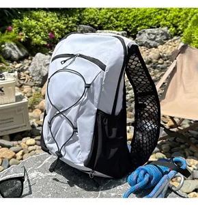 Detail shot of lightweight outdoor running vest backpack in black and white mesh design.