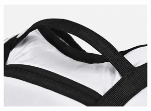 Close-up of durable reinforced backpack handle, featuring sturdy black webbing for outdoor use.