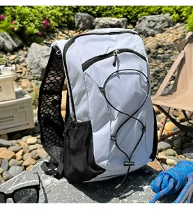 Outdoor running vest backpack detail showing breathable mesh shoulder straps and front bungee cord.