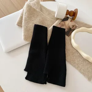 Black knit leg warmers for women, Japanese JK style slouch socks, cozy winter footwear accessories.