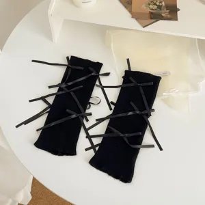 Black knitted leg warmers with multiple ribbon bows, sweet Lolita style knit socks for women.