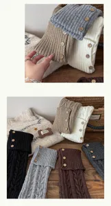 Detail view of cozy knit leg warmers featuring stylish cuffed design and wooden button accents.