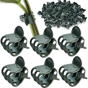 Détail de pinces pour plantes, pinces de support de jardin en plastique vert pour fleurs.